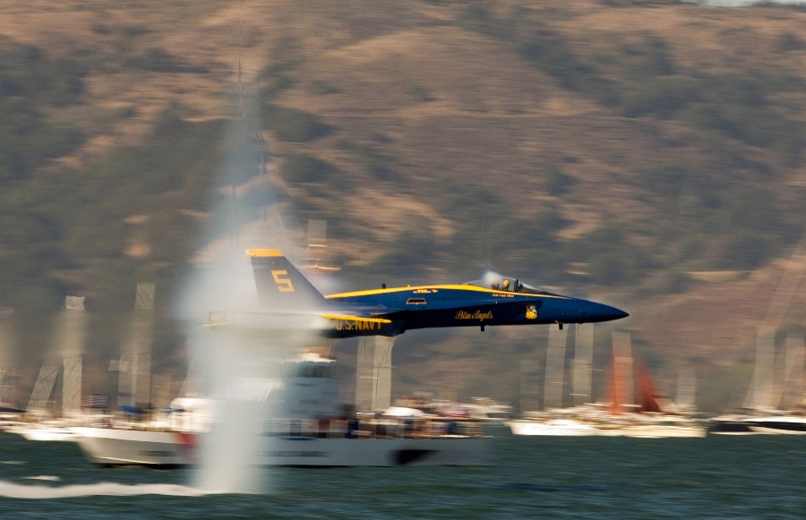 9. A U.S. Navy Blue Angels F/A-18 Hornet Fighter Jet Flying Low Over the Water at Speeds Just Below Mach 1 -- a Sneak Pass Maneuver Performed By the Lead Solo, October 9, 2005, San Francisco, State of California, USA. Photo Credit: Photographer's Mate 2nd Class Ryan Courtade, Navy NewsStand - Eye on the Fleet Photo Gallery (http://www.news.navy.mil/view_photos.asp, 051009-N-7559C-001), United States Navy (USN, http://www.navy.mil), United States Department of Defense (DoD, http://www.DefenseLink.mil or http://www.dod.gov), Government of the United States of America (USA).